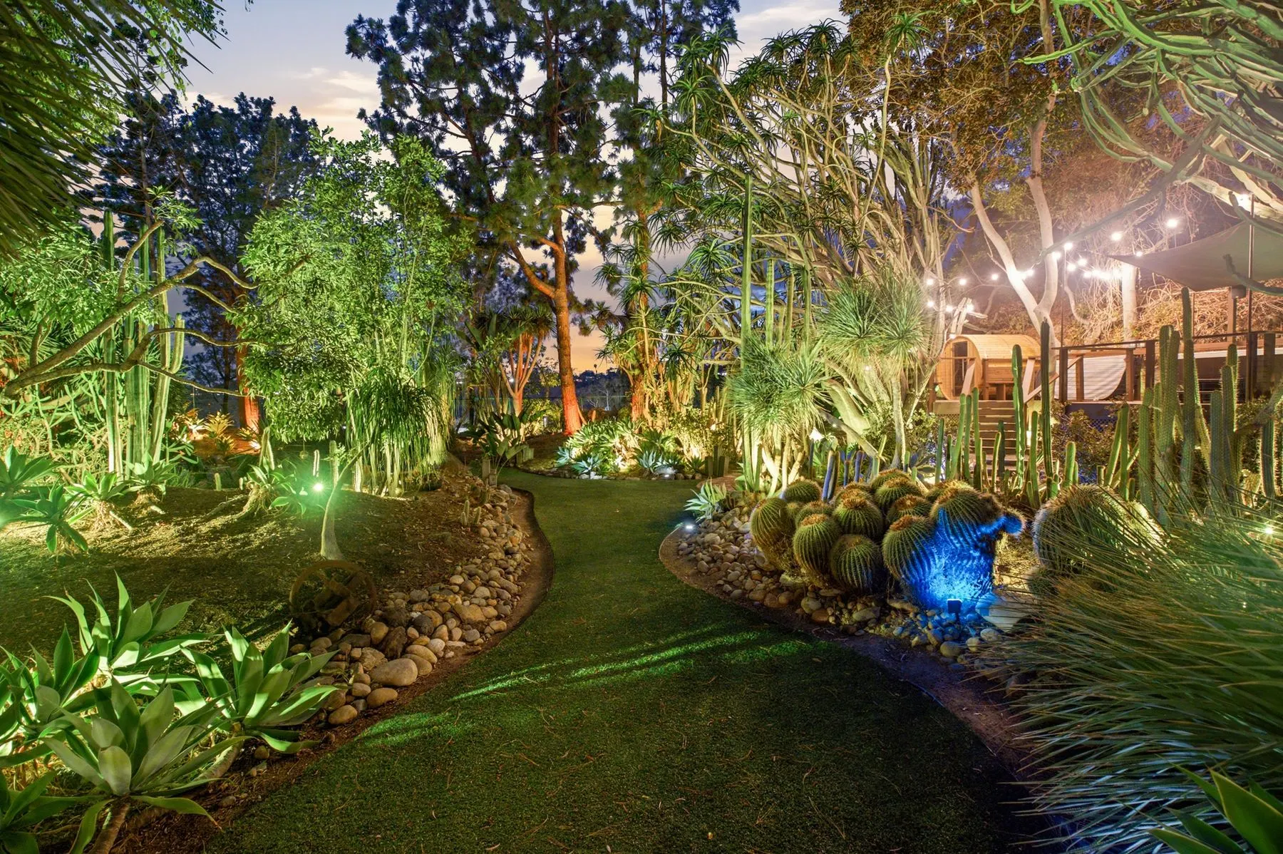 Dusk on the lawn as the garden lights come on