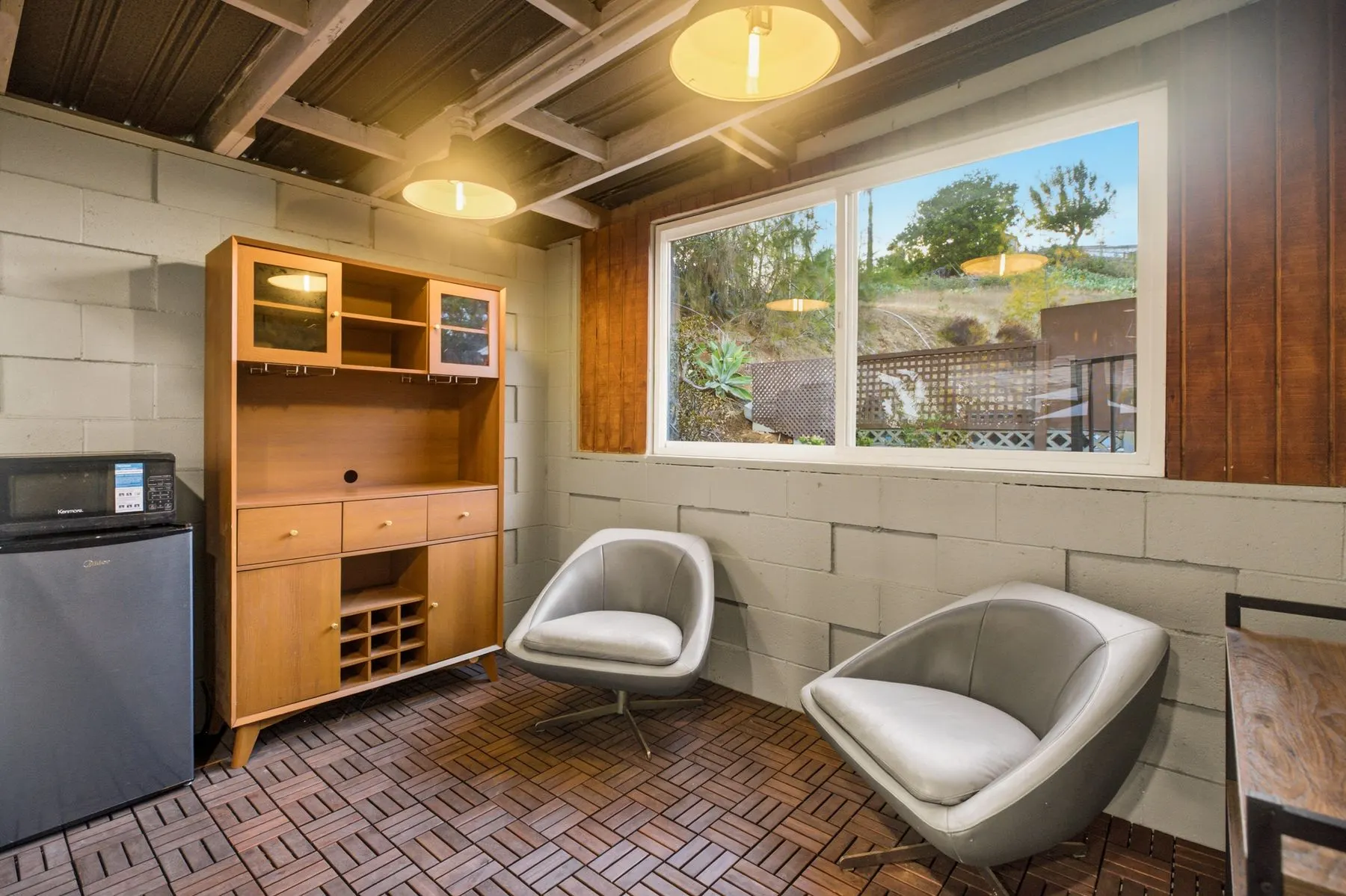 Outdoor lounge with mini fridge and wine storage