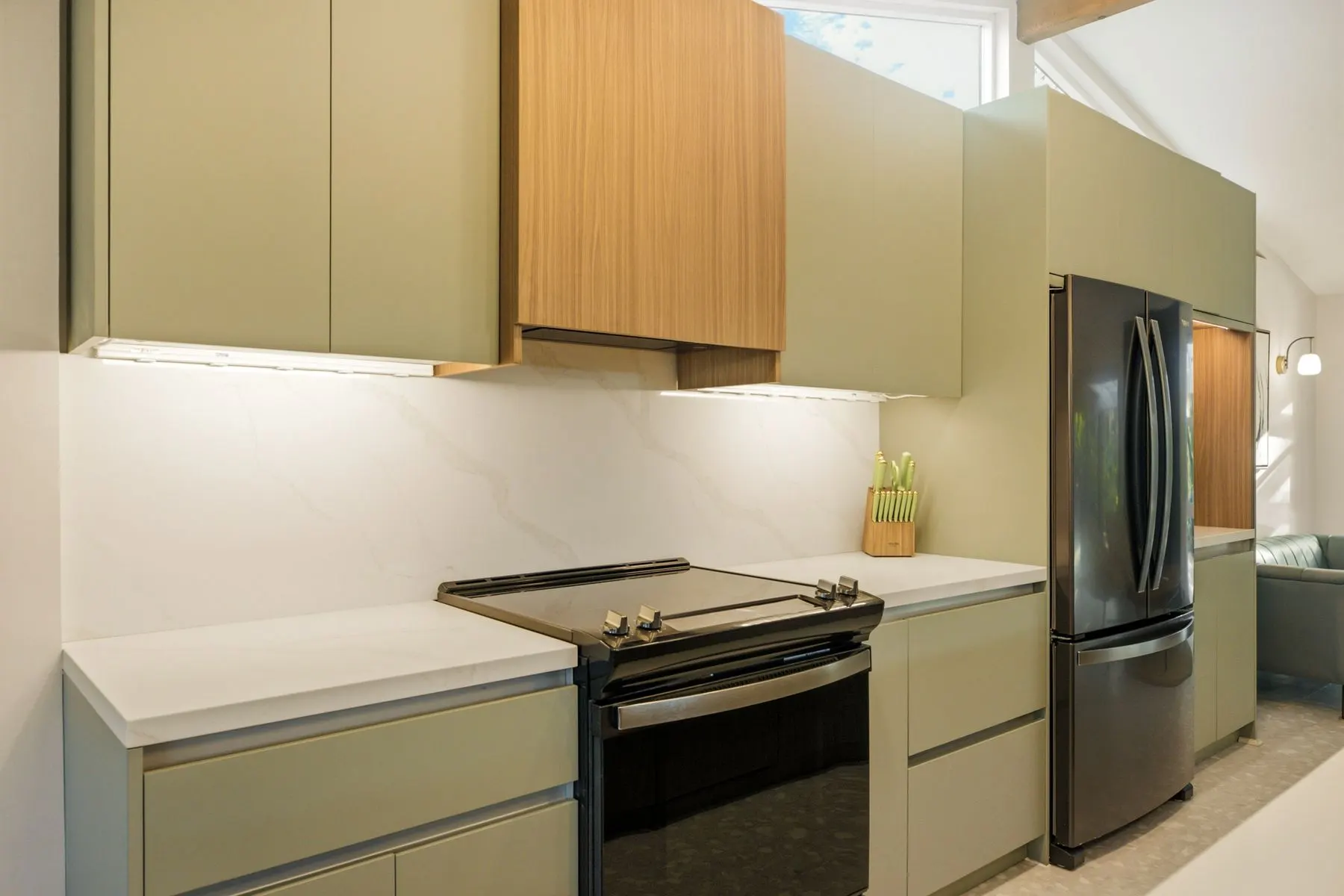 New Whirlpool range and fridge with custom sage-and-walnut cabinetry