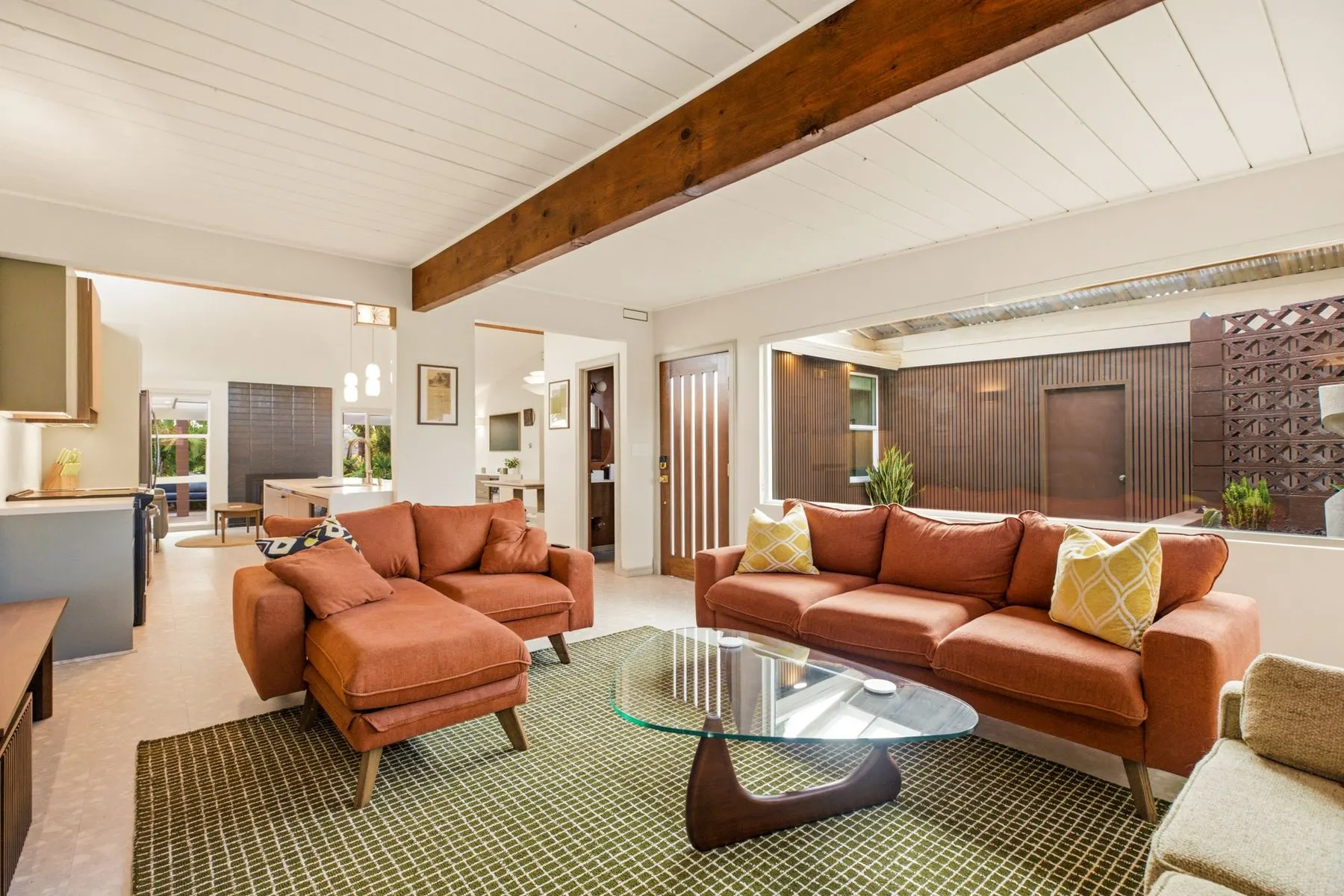 Vaulted ceilings and exposed beams, rebuilt from the studs in 2026
