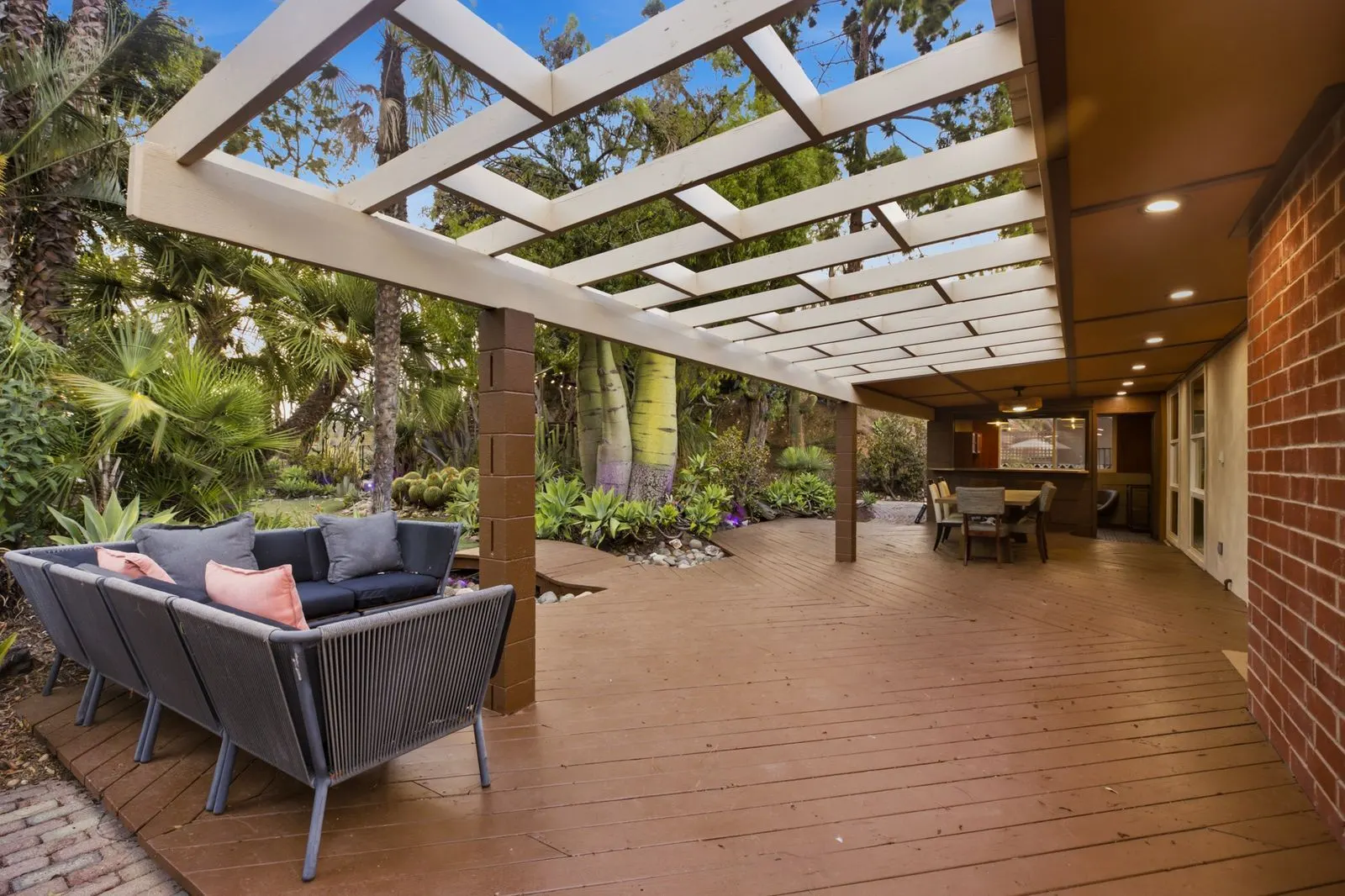 Outdoor sectional under the pergola on the back deck