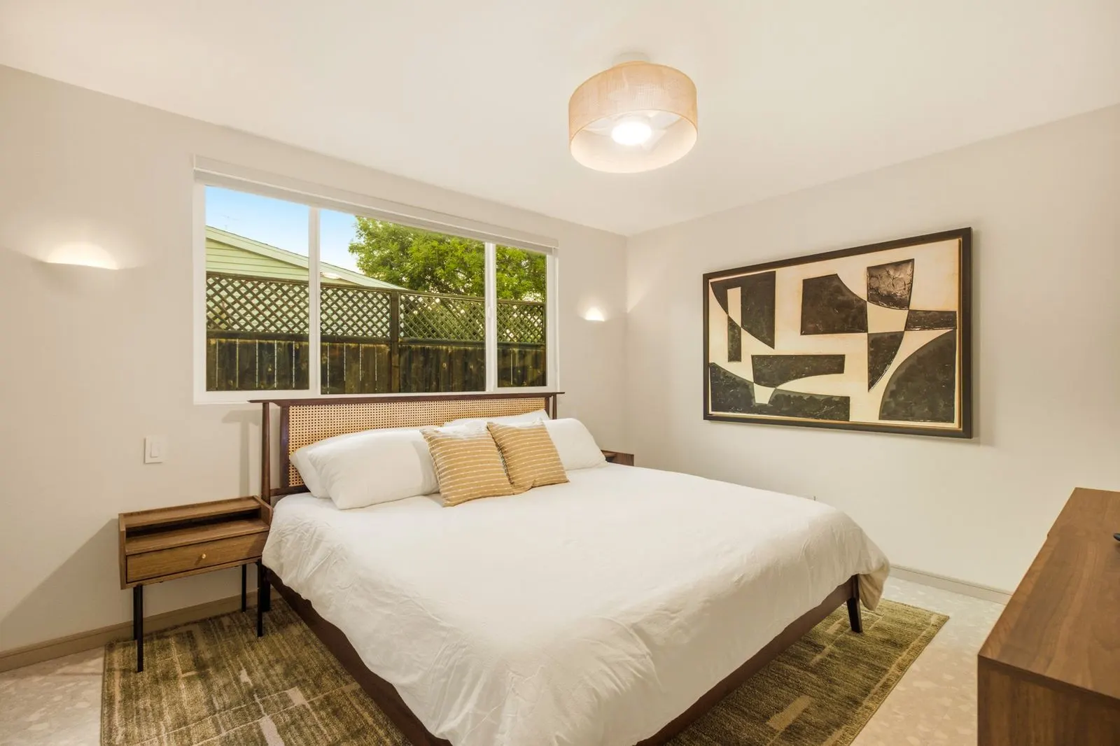 Primary bedroom with a king bed and garden window